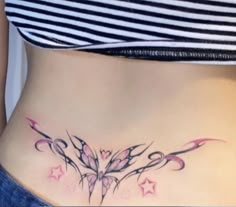 a woman's stomach with tattoos on it, and stars around the bottom part