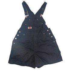 In great preowned condition! See photos for measurements and to ensure your happiness 😊  Embrace the 90s trend with these vintage black denim bib shortalls from Revolt. Made of comfortable cotton fabric, these overalls are perfect for casual and travel occasions. The dark wash denim and solid pattern give a classic and gothic vibe, while the hipster and retro style add a touch of festival and cowgirl flavor.  These women's shortalls come in size large and are perfect for any fashion-forward woman looking to make a statement. The denim fabric type and carpenter brand add a touch of toughness to the outfit, making it a versatile addition to any wardrobe. Don't miss out on the chance to own a piece of fashion history with these stylish Revolt shortalls. Womens Overalls, 90s Trends, Woman Looking, Outfit Making, Overalls Women, Solid Pattern, Dark Wash Denim, Fashion History, Denim Fabric