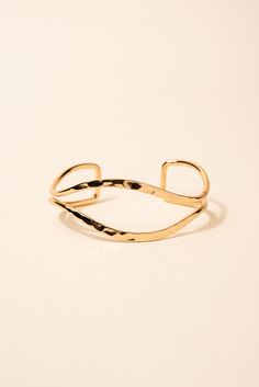 Made from high-quality metal, this bracelet features a unique open eyelid design that is sure to catch the eye. The hammered texture adds an extra dimension of interest to the piece. This cuff is adjustable to fit a variety of wrist sizes, ensuring a comfortable and secure fit. SizeLength: 6.5 in (16.51 cm)Width: 1 in (2.54 cm) Quality Made with a lightweight metal alloy to ensure that the bracelet is easy to wear and that it lasts for longer. Made with a glossy finish that make the bracelets be Metal Cuff Bracelet, Pearl Shop, Holiday Essentials, Gold Bracelet Cuff, Hammered Metal, Pearl Set, Silver Cuff Bracelet, Pearl Ring, Edgy Fashion