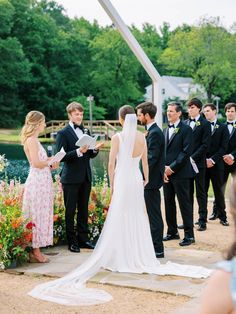 a bride and groom stand at the alter during their wedding ceremony