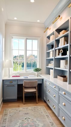 a home office with built - in desk and bookcases