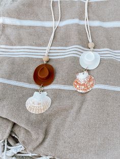 This coastal cowgirl car charm is perfect for any girly in your life! Hangs perfectly in your rearview mirror and has a cowboy boot charm in white or brown, and a natural seashell hanging from the bottom. The wooden bead is cute touch but also can be used for essential oils to diffuse in your car! Just add a drop or two of any of your choice to diffuse from the wooden bead. Shell color various but if there's a color that you want, just let us know. Seashell Hanging, Boot Charm, Cowboy Hut, Cowgirl Gifts, Car Hangers, Chapeau Cowboy, Shell Color, Car Diffuser, Coastal Cowgirl