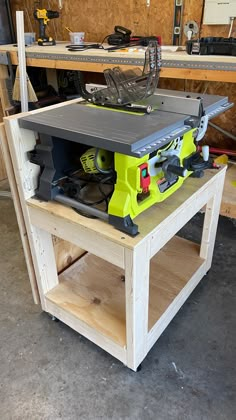 a table saw sits on top of a work bench