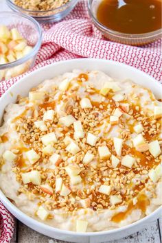 a bowl filled with oatmeal sitting on top of a red and white checkered table cloth