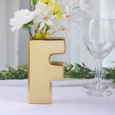 $7.99 | Add a touch of luxury to your decor with this gorgeous ceramic letter vase. It's crafted from high-quality ceramic and features a lustrous metallic gold finish that adds instant glamour to any space. The top opening makes it easy to insert flowers or other decorative items, and the alphabet design means you can spell out any word or phrase you like. Whether you use it as a centerpiece or as a fun way to personalize your home or event decor, this vase is sure to make a statement. Elegant Table Settings, Letter F