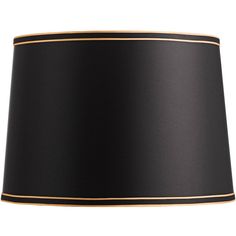 a black lamp shade with gold trim