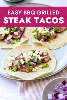 easy bbq grilled steak tacos on a white plate with red onions and cilantro