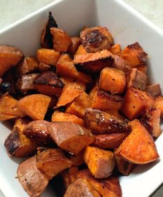 a white bowl filled with cooked sweet potatoes