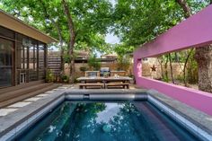 a backyard with a pool and picnic table