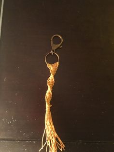 a pair of scissors hanging from a rope