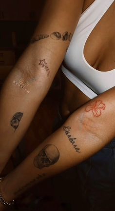 two women with tattoos on their arms