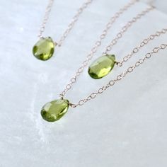 Sparkly Peridot briolette stone, suspended on a rose or yellow gold-filled or sterling silver chain. The perfect August gift for your special person. Worn alone or layered with your favorite chains. The light green color is just beautiful. genuine Peridot Approx. 1-carat+ 10 x 6 mm -sizes vary, most are larger Pear Briolette Light yellow-green (lime green) - varies Transparent with eye-visible inclusions Made to Order - Production time is 1-7 days depending on quantity Order :: select metal pref Faceted Peridot Necklaces As Gift, Faceted Peridot Necklaces For Gift, Gift Peridot Faceted Necklaces, Green Briolette Necklace For Gift, Green Briolette Necklace Gift, Peridot Briolette Necklace As Gift, Briolette Peridot Necklaces As Gift, August Birthstone Necklace, Tanzanite Necklace