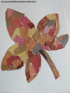 an art project made out of colored paper with a dragonfly on it's back