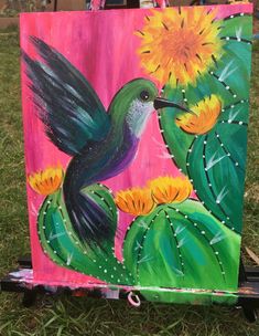 a painting of a hummingbird on a cactus