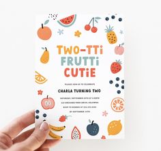 a person holding up a card that says two - ti frutti cutie