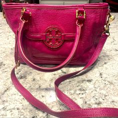 Beautiful Tory Burch Handbag Comes With Crossbody Straps New Condition, Never Worn Rare Beautiful Fuschia/Pink Color Gold Tory Burch Emblem On Front Tory Burch Logo Lining On All Insides And Pockets Gold Zipper Accents 12” Length 4.5” Width 4” Depth Pink Formal Satchel, Designer Pink Top Handle Shoulder Bag, Designer Pink Handheld Bag, Designer Pink Satchel For Travel, Pink Rectangular Satchel With Gold-tone Hardware, Pink Top Handle Bag With Gold-tone Hardware, Designer Pink Bag With Gold-tone Hardware, Pink Handheld Bag With Gold-tone Hardware, Pink Handheld Bags With Gold-tone Hardware