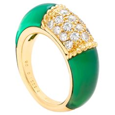 18ct gold Very Rare Van Cleef & Arpels PHILIPPINES ring Set with 2 polished green Chrysoprase hard stones either side of a Diamond Pave centre. Van Cleef & Arpeks arguably the Master of all French Maisons presents this absolute classic style, and beautiful example for a VCA collector. Signed: VCA Makers mark 750 (18ct) Luxury Green Ring With Polished Finish, Luxury Green Rings With Polished Finish, Green Diamond Ring With Polished Finish, Formal Green Enamel Ring With Polished Finish, Elegant Green Enamel Ring With Polished Finish, Elegant Green Polished Ring, Green Enamel Ring For Formal Occasions, Green Oval Enamel Ring For Anniversary, Oval Green Enamel Anniversary Ring