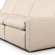 the back end of a beige couch on a white background