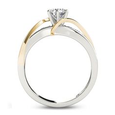 a white and yellow gold engagement ring with a single diamond in the center, on a white background