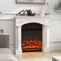 a living room with a fire place in the center and a painting on the wall