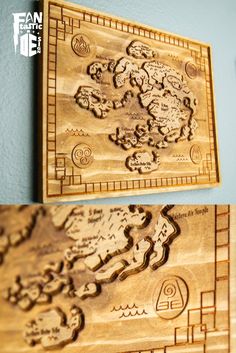 two wooden maps are hanging on the wall, one is made from wood and the other has