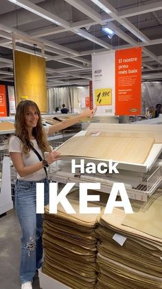 a woman standing in front of stacks of papers with the words hack ikea on it