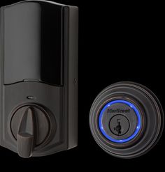 an electronic door lock with blue light on the front and back buttons in black background