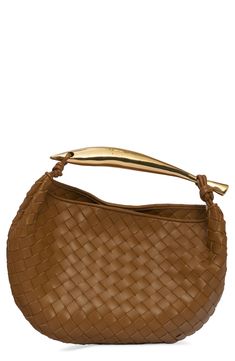 The brand's iconic intrecciato weave, handwoven from strips of lambskin, textures this softly structured hobo bag topped with a sculptural metallic handle. Magnetic closure Top carry handle Unlined Leather Made in Italy Designer Handbags Luxury Brown Shoulder Bag With Interwoven Design, Designer Hobo Bag With Round Handle, Designer Brown Hobo Bag For Evening, Brown Intrecciato Weave Evening Shoulder Bag, Designer Handheld Shoulder Bag With Intrecciato Weave, Designer Woven Leather Hobo Bag For Evening, Designer Brown Woven Leather Shoulder Bag, Luxury Brown Hobo Bag With Braided Handles, Formal Hobo Bag With Intrecciato Weave And Top Handle