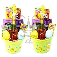 two yellow buckets filled with different types of easter eggs and confection items