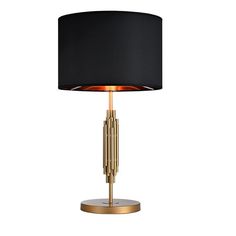 a black lamp with gold accents on a white background and a black shade over it