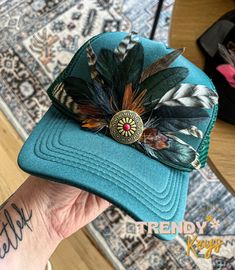 this high profile foam trucker hat is one of a kind handmade with feathers and steel rivet included as shown! 🖤Each hat will be unique and slightly vary from the photo due to unique variations in feathers. basic color scheme and style will be the same. Custom Hats With Feathers For Rodeo, Custom Curved Brim Hat With Feathers, Feather Hat Accent, Feather Trucker Hat, Western-themed Fedora With Feather Trim, Feather Embroidery, Diy Hat, Cowgirl Hats, Embroidery Patches