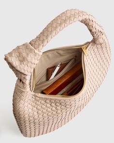 This Italian Leather Handwoven Slouchy Shoulder Bag is the epitome of luxury and style. Handcrafted from the finest Italian leather, this bag features a clean handwoven design that adds a touch of sophistication to any outfit. The slouchy silhouette gives it a relaxed and effortless vibe, perfect for everyday use or special occasions. With ample space and two pockets for all your essentials, this shoulder bag is both practical and chic. Make a statement with this versatile piece that will elevate your look and stand the test of time.  | Quince | Women's Italian Leather Handwoven Slouchy Shoulder Bag in Taupe Elegant Woven Leather Shoulder Bag For Travel, Elegant Woven Leather Pouch Bag, Office Bags With Braided Top Handles, Office Bag With Braided Top Handle, Elegant Beige Woven Leather Bags, Office Bags With Top Handle And Braided Handles, Elegant Beige Woven Leather Shoulder Bag, Chic Handheld Woven Bag, Elegant Natural Woven Leather Bag