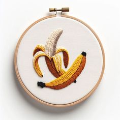 the embroidery pattern shows two bananas as if they were made from banana peels and other fruit