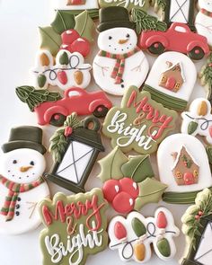 decorated christmas cookies are displayed on a table