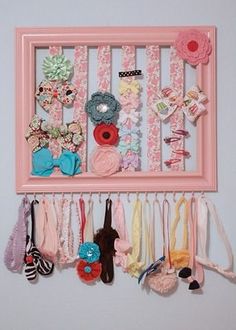 a pink frame with many different items hanging on it