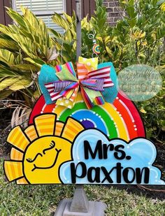 a wooden sign that says mr's paxton with a sun on it