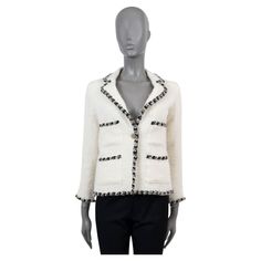 100% authentic Chanel tweed jacket in cream wool (with 3% nylon). Features a contrast braided trim in black, beige and cream, four patch pockets and a notched lapel. Closes with a antique gold button on the front and is lined in silk (with 5% elastane) with chain along the bottom hem. Has been worn and armpit lining shows stains on both sides. Exterior is in excellent condition. Measurements Model 06A P29473 V19941 Tag Size 38 Size S Shoulder Width 37cm (14.4in) Bust From 88cm (34.3in) Waist Fro Channel Coat, Chanel Cream, Chanel Tweed Jacket, Four Patch, Chanel Tweed, Outerwear Coats, Tweed Jacket, Braids, Chanel