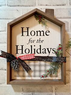 a sign that says home for the holidays