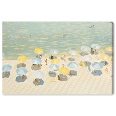 an image of people on the beach with umbrellas