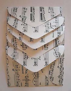 sheet music notes are stacked on top of each other to form a wall art piece