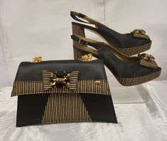 This black and gold matching bag and shoe set is designed to meet your party needs. It will enable you to stand out and look your very best! Sizes available in EU 38, 39, 40,42. The heel is about 4 inches/ 10.16 centimetres  The shoes have an option of 3 different types bags, please message for the bag you desire. Material is Italian Leather Please message if you have any further inquiries! Thank you Designer Black Evening Bag For Party, Designer Black Evening Bag For Events, Designer Black Evening Bag For Night Out, Chic Black Evening Bag For Gala, Gold Evening Heels For Events, Designer Gold Evening Bag For Gala, Chic Gold Heels For Evening, Chic Gold Evening Heels, Black Heels For Formal Parties