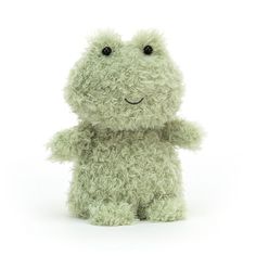 a small stuffed animal sitting up against a white background