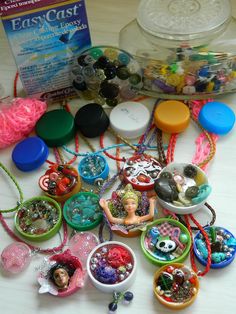 a table topped with lots of different types of jewelry and bracelets on top of it