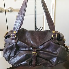 Kooba Satchel In Interesting Purple/Brown Color. Very Unique. Leather Is In Excellent Condition. Gold Hardware And Great Interior Pockets. Big Purse, Slouchy Bag, Leather Satchel, Brown Color, Gold Hardware, Satchel, Jewelry Accessories, Bag Lady, Shoulder Bag