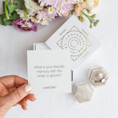 someone holding up a card that says what is your favorite memory with the bride or groom?