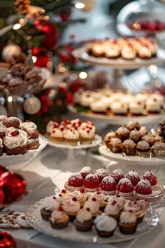 a table topped with lots of desserts and pastries