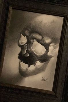 a black and white drawing of a skull