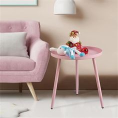 a small pink table with a toy on it