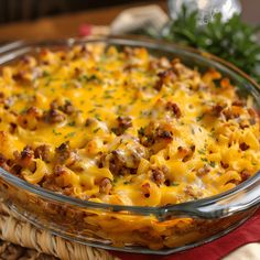 a casserole dish with sausage and cheese