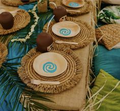 the table is set with plates and place settings for guests to sit down on it